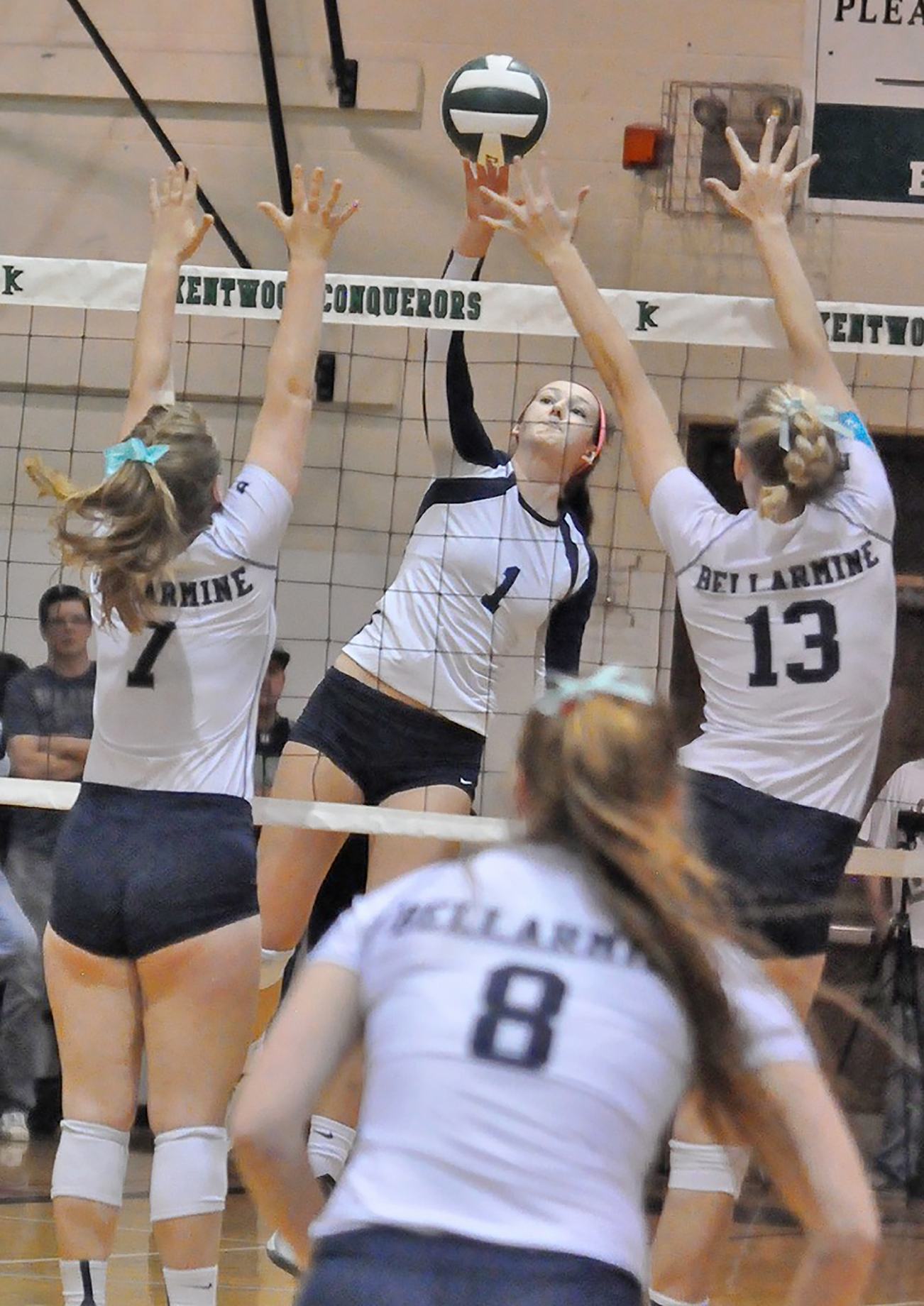 The Ravens’ Anna Maracich delivers a spikes between the Bellarmine Prep defense during the district championship Saturday at Kentwood High School. RACHEL CIAMPI, Auburn Reporter