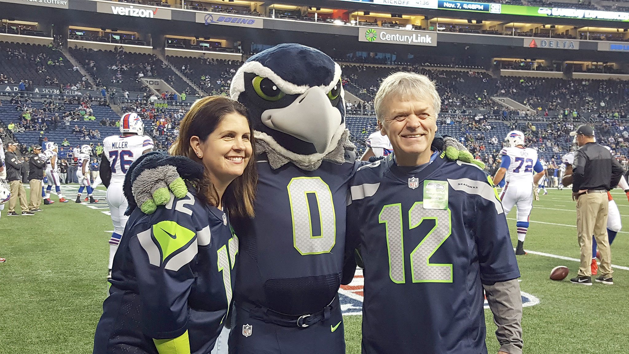 Auburn School District teachers Melissa Sergis and Tim Scott share a moment with Seahawks mascot Blitz before Monday night&rsquo;s Seattle-Buffalo game at CenturyLink Field. COURTESY PHOTO