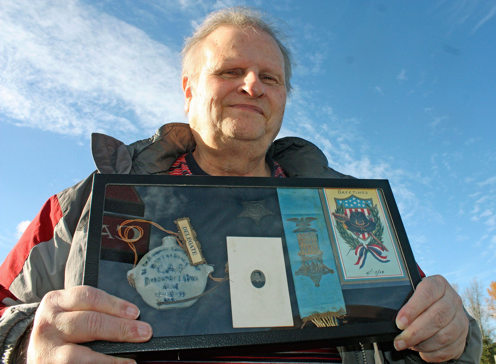 Kent’s Jim Dimond, a historian, holds a collection of mementos from Civil War veterans. Dimond ensures lost or forgotten Civil War veterans are recognized. MARK KLAAS, Kent Reporter