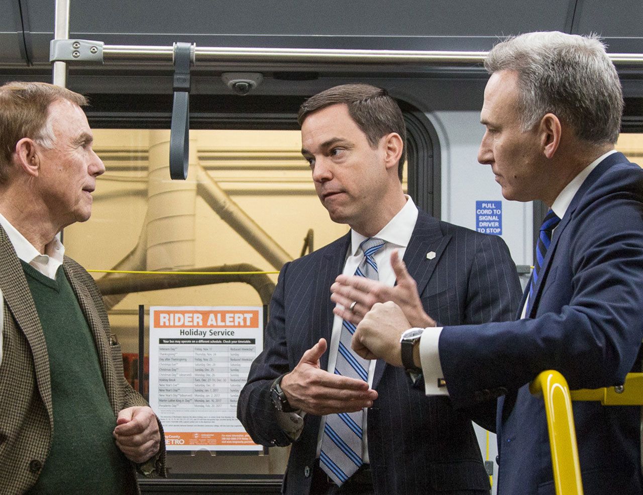King County Councilmember Pete von Reichbauer, left, discusses King County’s purchase of electric battery buses with Proterra CEO Ryan Popple, middle, and King County Executive Dow Constantine. COURTESY PHOTO