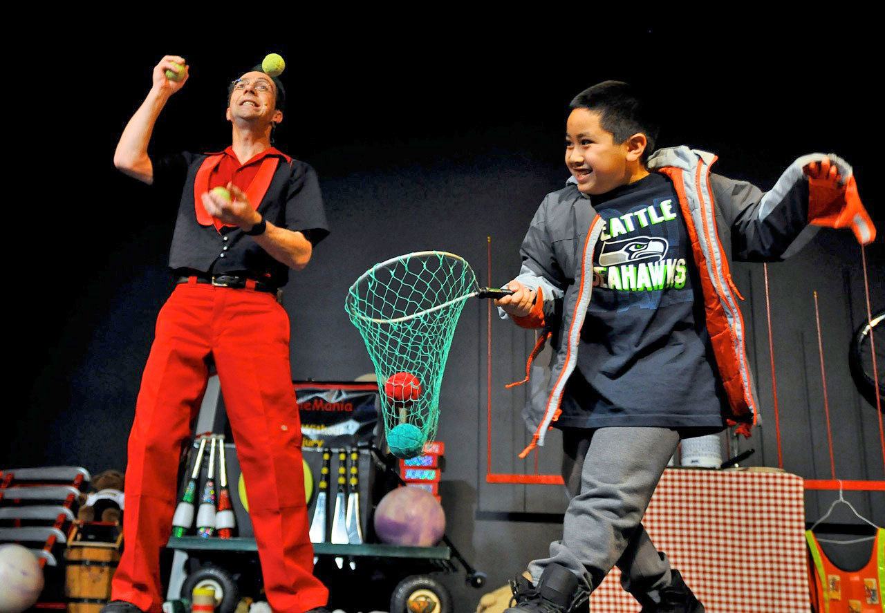 Rhys Thomas has Damon Nguyen help him with his juggling trick during a past performance at the Auburn Avenue Theater. The juggling magician returns to the Ave to perform Saturday. See the entertainment listings for details. RACHEL CIAMPI, Auburn Reporter