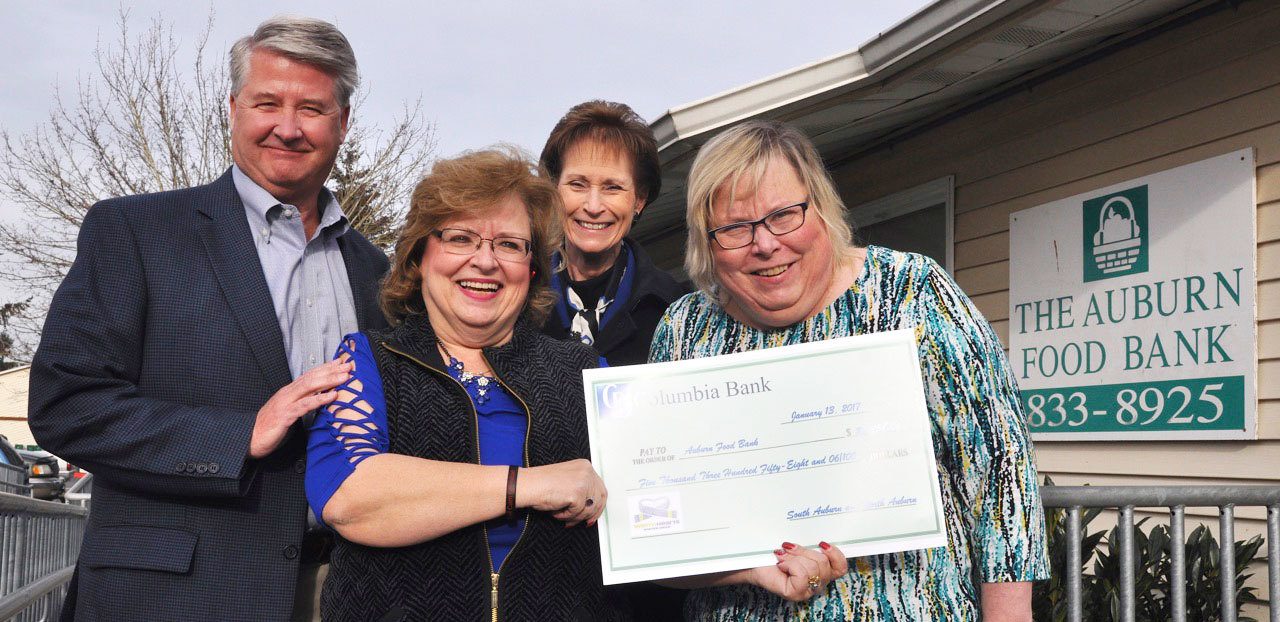Columbia Bank presents a $5,358.06 check to the Auburn Food Bank. At the presentation are, from left: Chuck Folsom, food bank president; Debbie Christian, food bank executive director; Diane Fritschy, Columbia Bank branch manager; and Michelle LaBorde, south Auburn Columbia Bank branch manager. RACHEL CIAMPI, Auburn Reporter