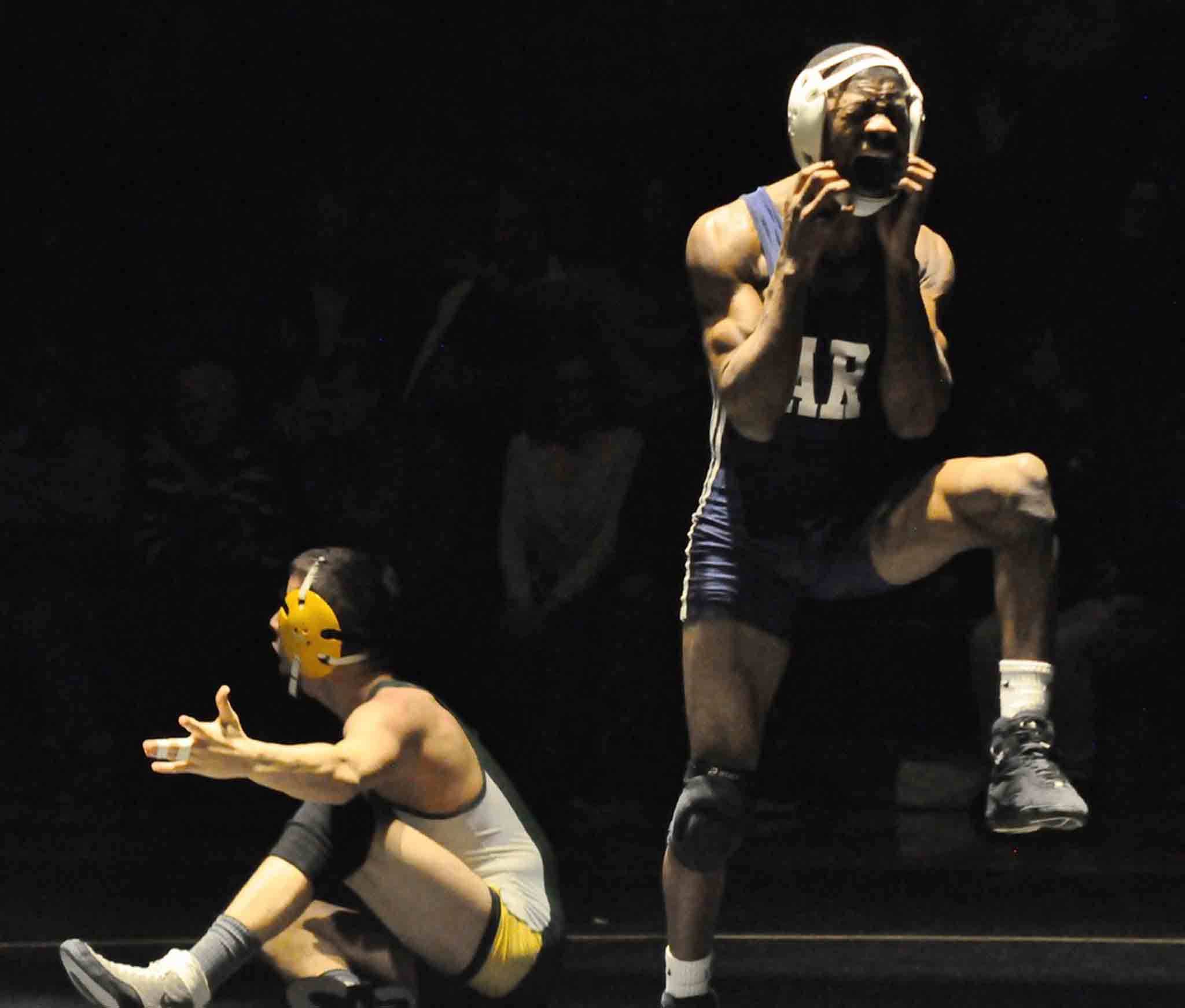 Auburn Riverside’s 120-pound Yusef Nelson celebrates after pinning Auburn’s Gabe Sena in the third period of their bout Wednesday night. The Ravens went on to seize the NPSL Olympic Division dual title. RACHEL CIAMPI, Auburn Reporter