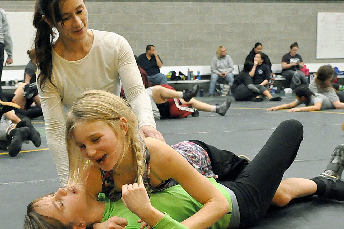 Muscle tussle local girls get a grip on wrestling at camp Auburn