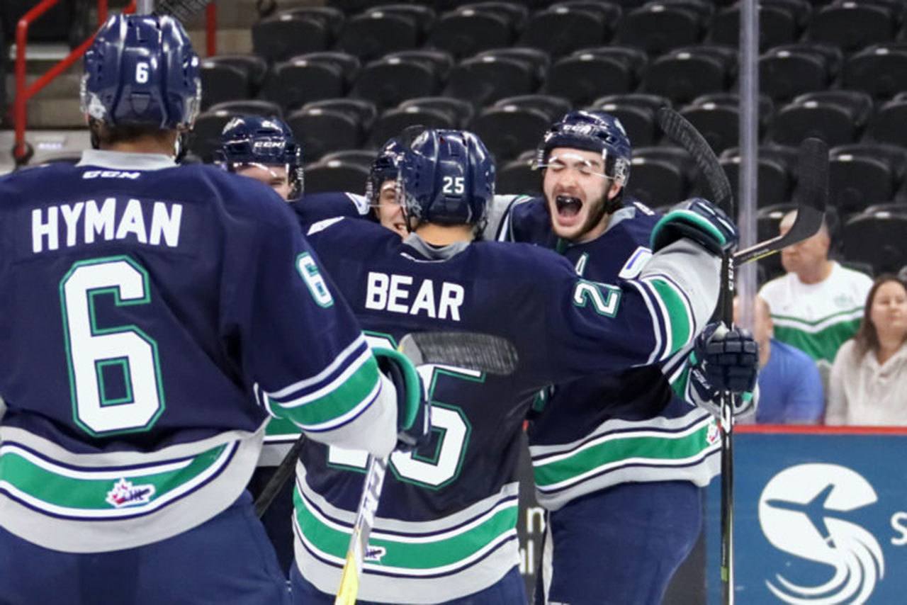 The Thunderbirds celebrate Austin Strand&rsquo;s game-winning goal in overtime against the Chiefs on Tuesday night. COURTESY PHOTO, Larry Brunt
