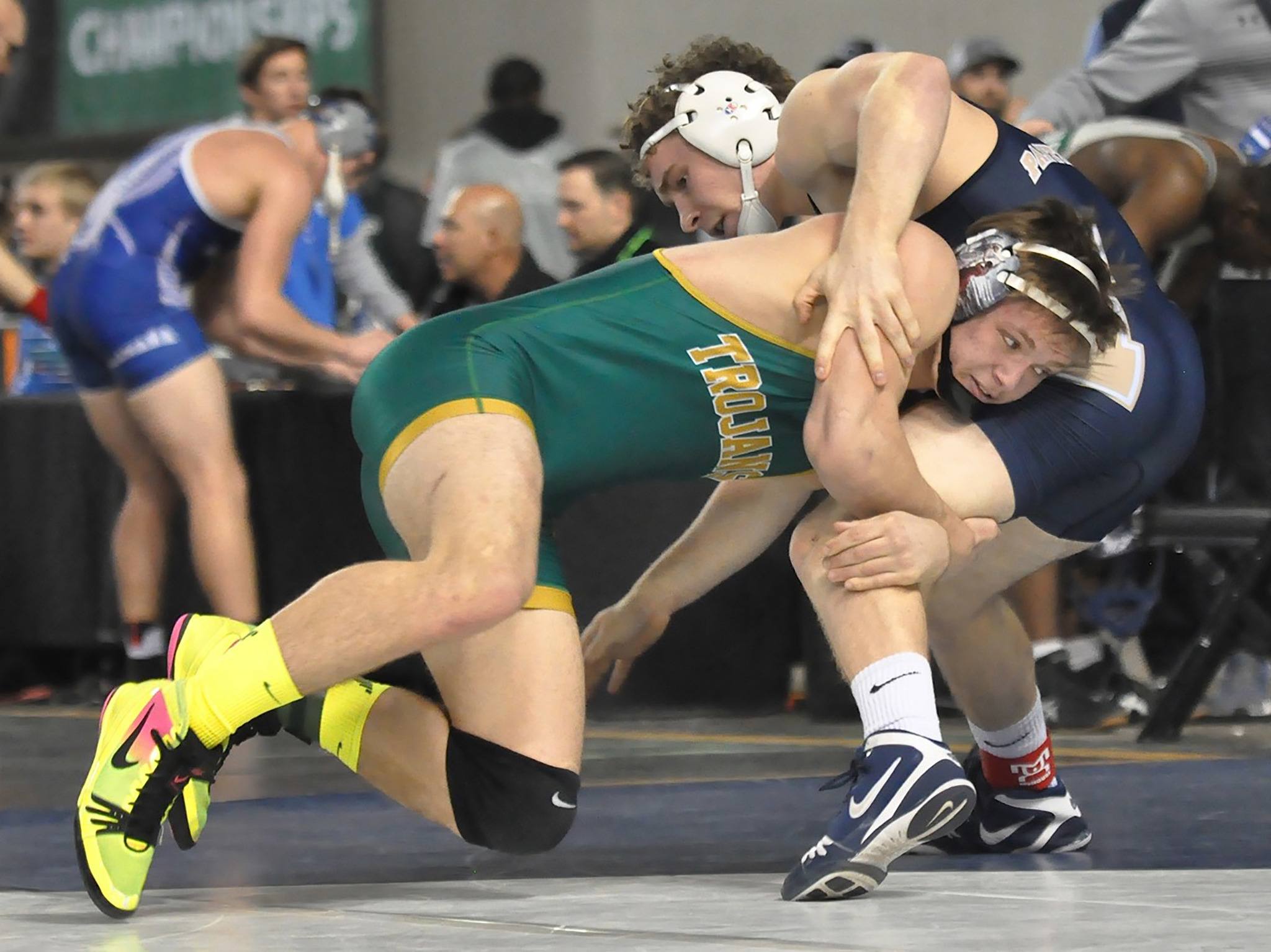 Auburn’s Cole Washburn, bottom, tangles with Mead’s Trevor Senn, the eventual state champion, in the 182-pound semifinals at Mat Classic XXIX at the Tacoma Dome on Saturday. Senn scored an 8-7 decision. Washburn recovered to finish third. RACHEL CIAMPI, Auburn Reporter