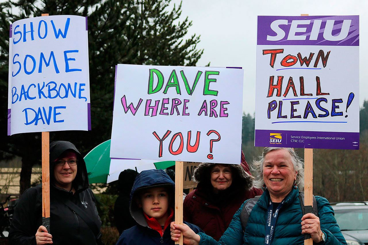Congressional District 8 residents marched to Rep. Dave Reichert’s (R-WA) Issaquah office Tuesday morning to protest what they see is the congressman’s lack of availability for his constituents. REPORTER PHOTO, Nicole Jennings