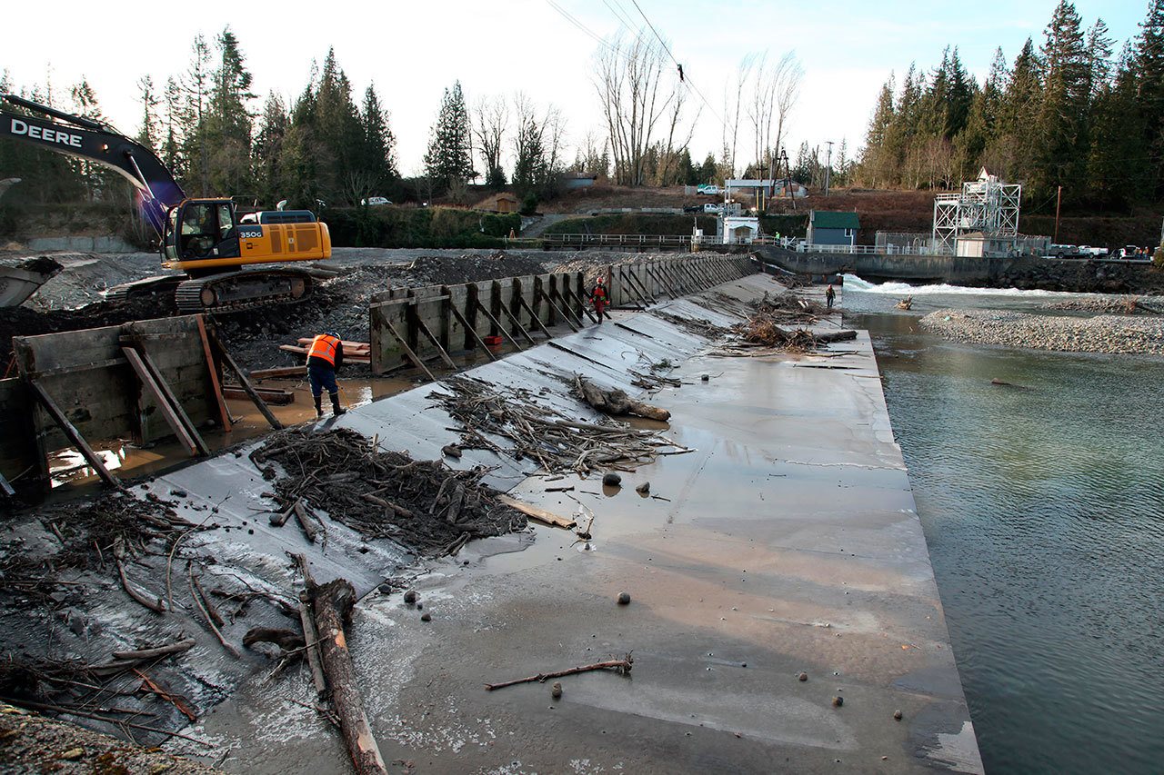 Workers repair the White River Diversion Dam near Buckley. U.S. Army Corps of Engineers lowered White River flows from Mud Mountain Dam this week to ensure worker safety while making the repairs. The river was also diverted to the south side of the structure. COURTESY PHOTO, Bill Dowell, U.S. Army Corps of Engineers