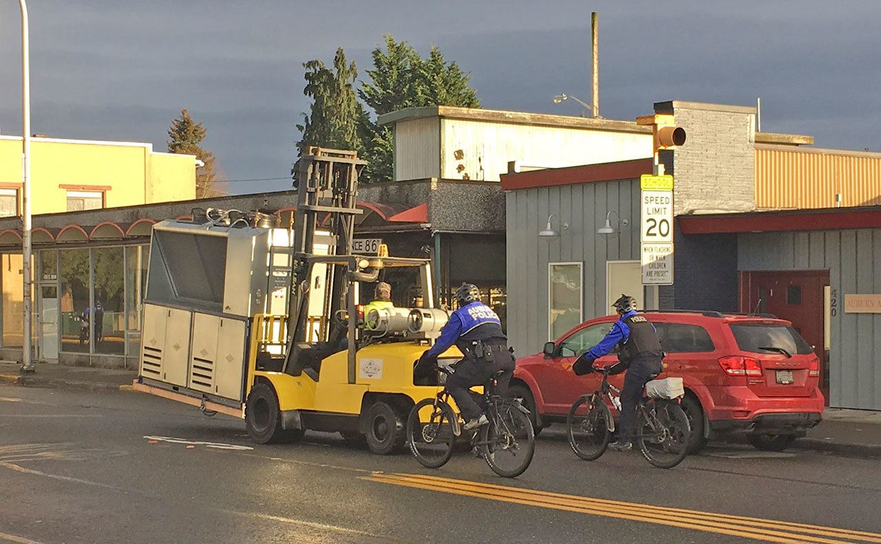 With an Auburn Police escort down Main Street last Friday, Auburn vendor Pro Refrigeration transports a custom chilling unit it developed for Geaux Brewery. COURTESY PHOTO