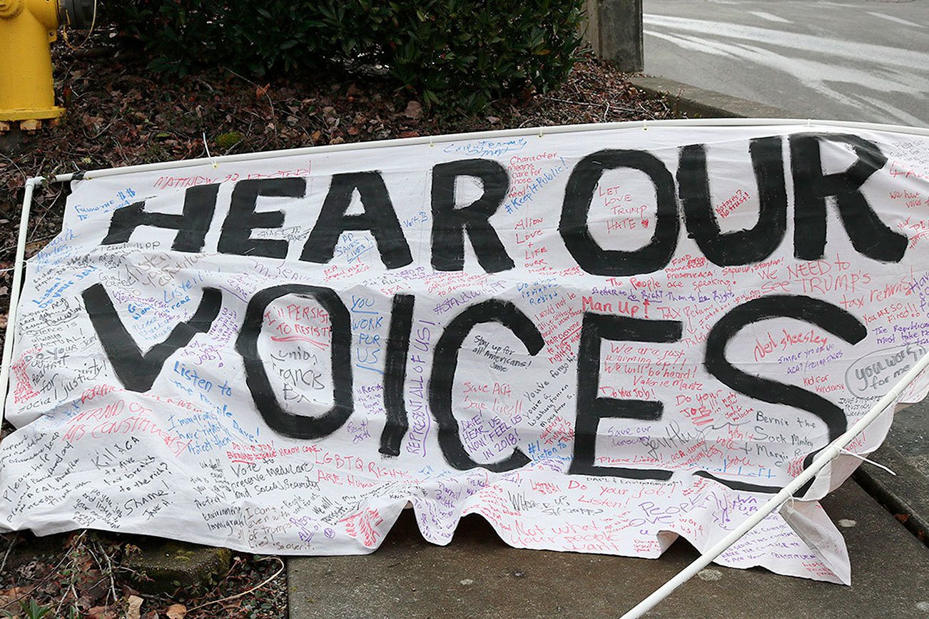 Affordable Care Act, immigration headline concerns of 1,000 anti-Reichert protesters