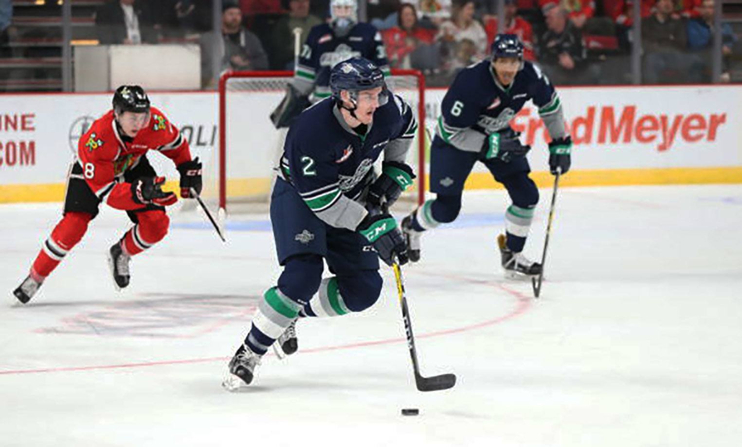 The Thunderbirds’ Austin Strand brings the puck up the ice against the Winterhawks on Saturday night. COURTESY PHOTO, Bryan Heim