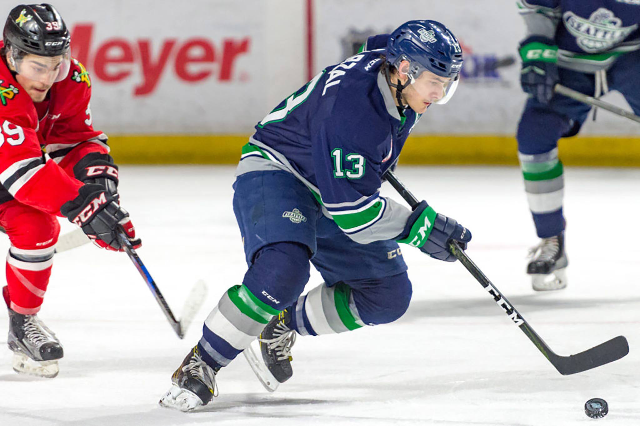 The Thunderbirds’ Mathew Barzal directs the puck up the ice against the Winterhawks on Saturday night. Barzal produced a career-best six-point night in an 8-5 WHL win at the ShoWare Center. COURTESY PHOTO, Brian Liesse/T-Birds