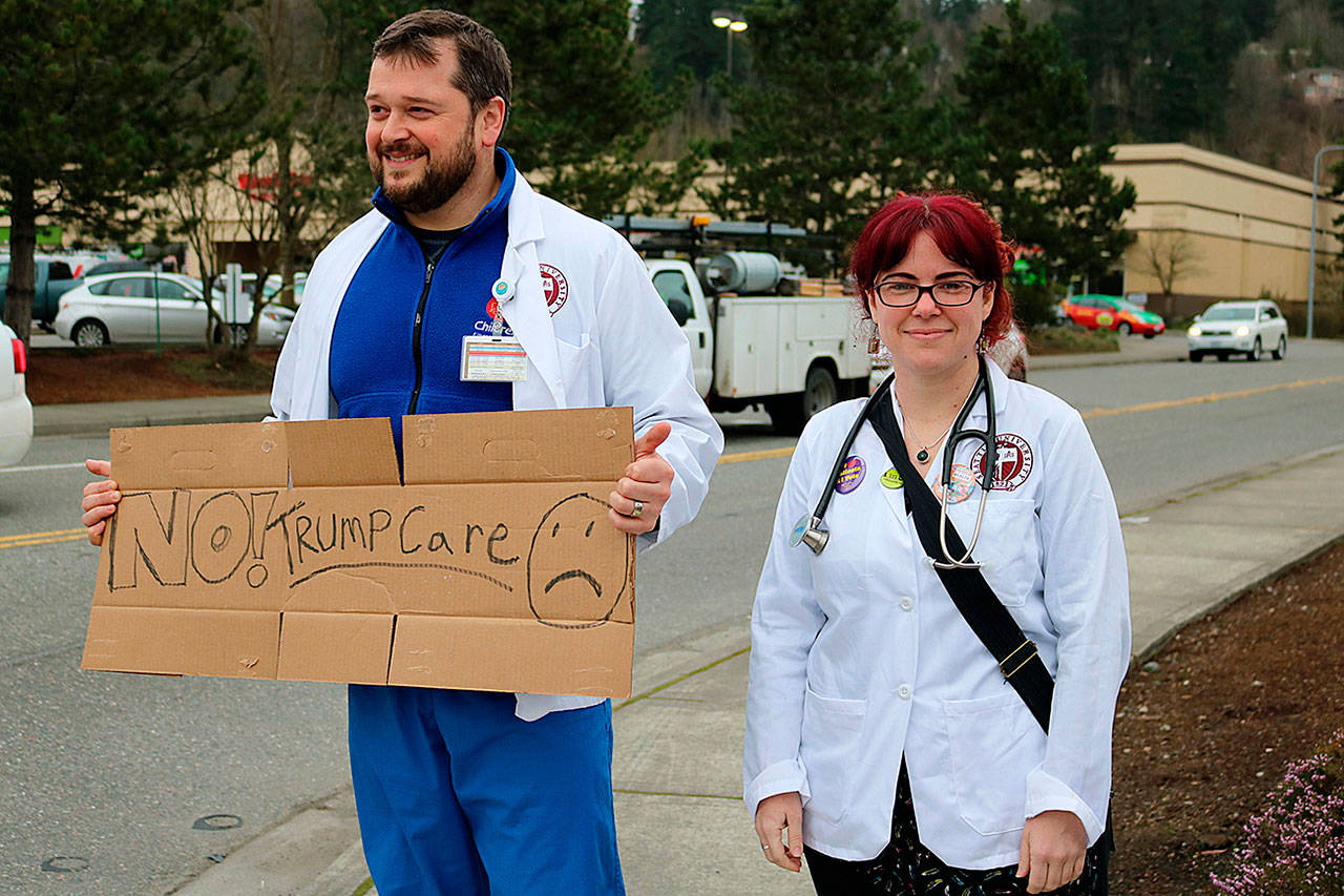 Jeremy King and Erin Gilmer are Seattle University nursing students and work with patients at Swedish Medical Center Issaquah, many of whom they said are in danger of losing health coverage if Trumpcare passes. REPORTER PHOTO, Nicole Jennings