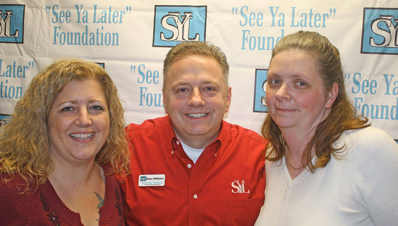 Helping others: April Lazara, left, and Stacey Schwartfigure join Brian Williams, See Ya Later Foundation leader and coordinator, at an open house to celebrate the organization’s first home last week. MARK KLAAS, Auburn Reporter