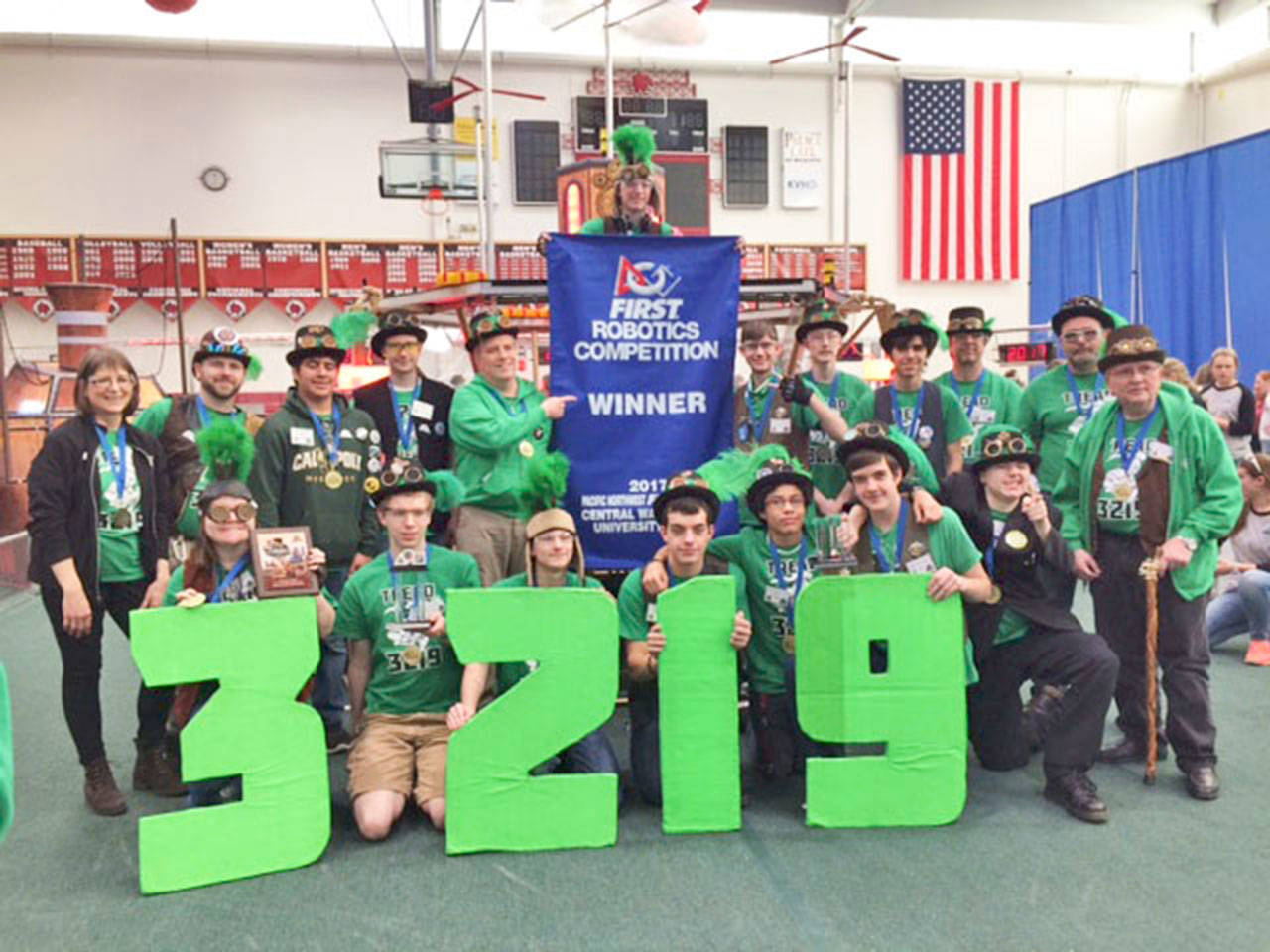 Led by team mentor Jan Eric, Auburn High School’s Trojan Robotics, Engineering and Design (TREAD) team beat the district competition. COURTESY PHOTO