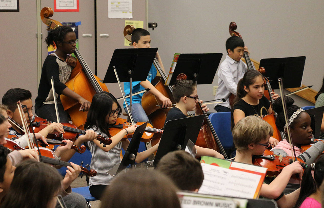 Sixth-graders with the Rainier Middle School orchestra practice for the upcoming festival. COURTESY PHOTO