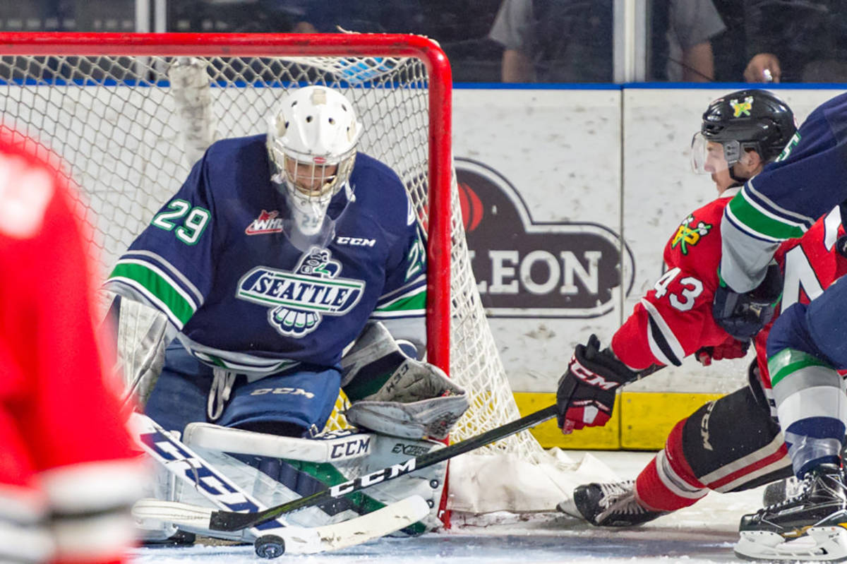The Winterhawks’ Sykler McKenzie fires a shot at Thunderbirds goalie Matt Berlin during WHL play Saturday night at the ShoWare Center. Portland outshot Seattle in the game 41-32 to take a 4-1 win, denying Seattle of a second straight division title. COURTESY PHOTO, Brian Liesse, T-Birds.