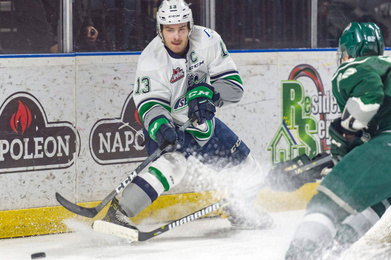The Thunderbirds’ Mathew Barzal drives the puck away from the boards during WHL playoff action Tuesday night at the ShoWare Center. Barzal scored twice, including the game-winning shot, to lead Seattle past the Everett Silvertips 5-4 for a commanding 3-0 lead in their best-of-seven Western Conference semifinal series. COURTESY PHOTO, Brian Liesse, T-Birds.