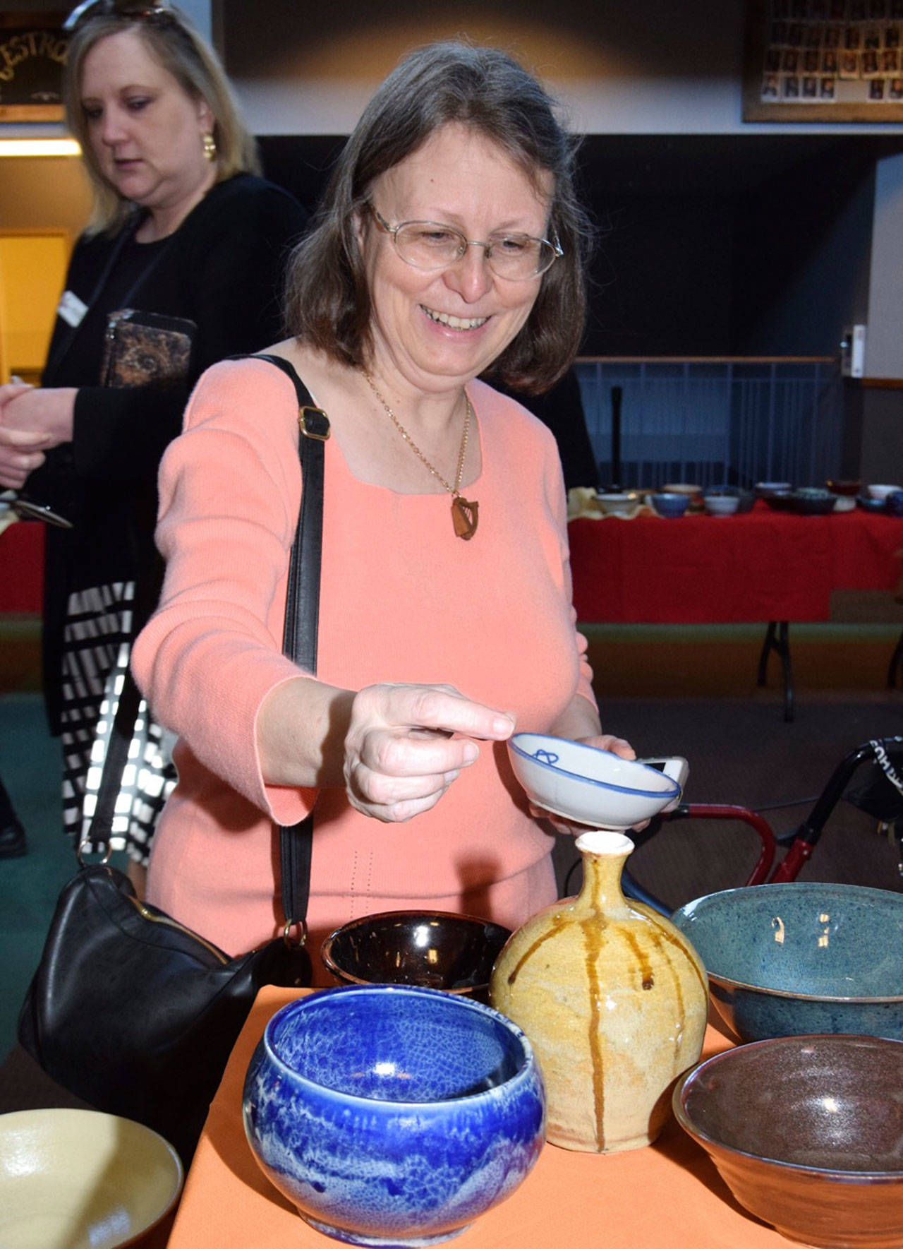 Avis Cawley looks at a bowl during the luncheon on Friday. REPORTER PHOTO, Rachel Ciampi