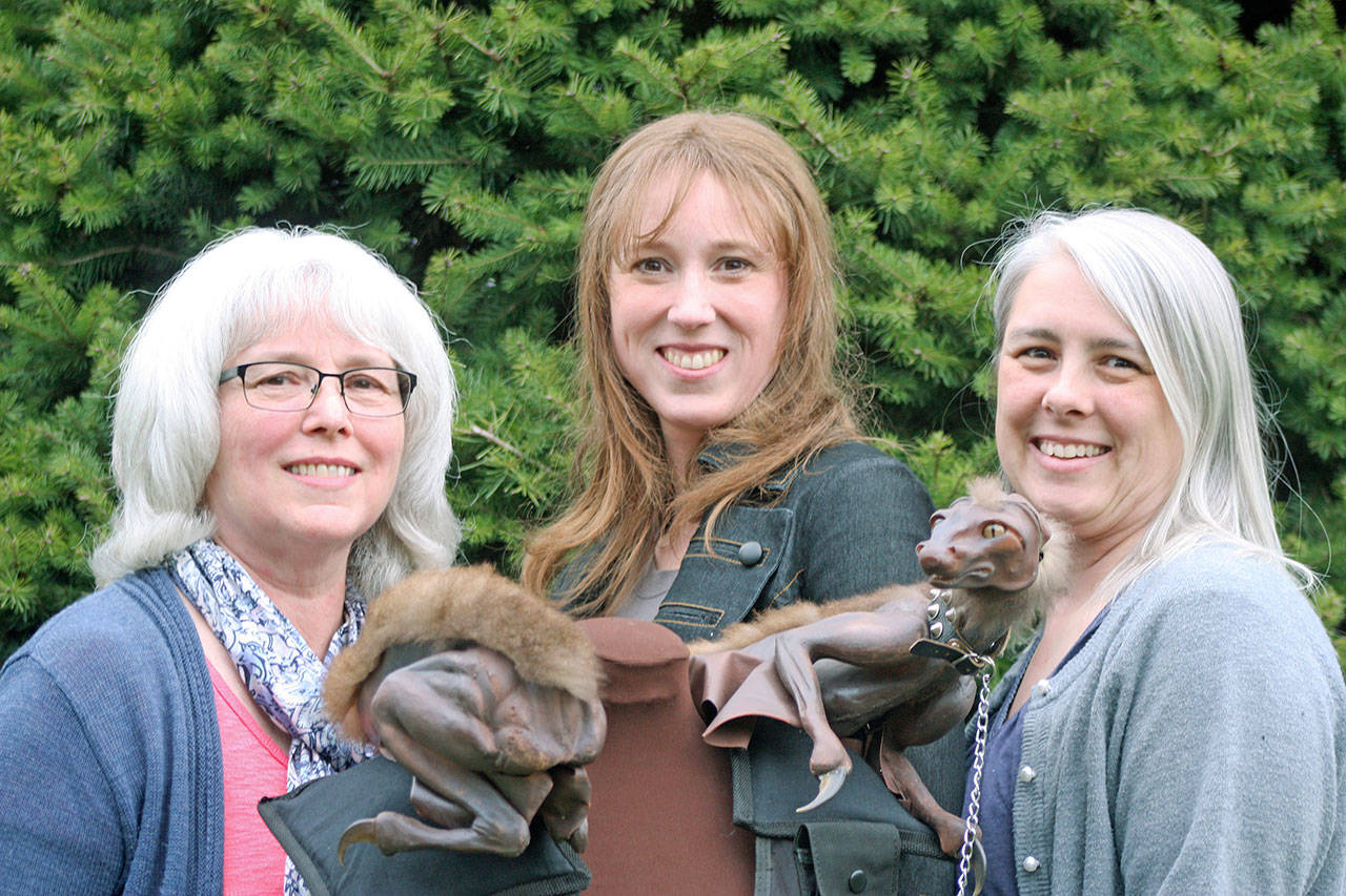 Jeanine Bartelt, left, Jolene Loraine, middle, and Carrie Avery Moriarty have started up a film company, White Horse Entertainment. Larkrae, an animal character prototype, is from Jolene Loraine’s ‘Night Hawk’ book series. MARK KLAAS, Reporter