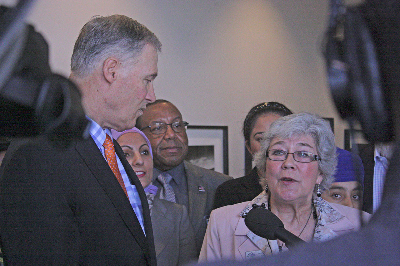 Flanked by Gov. Jay Inslee, Kent Mayor Suzette Cooke talks about the importance of including immigrants in the community during a news conference at Kent’s Centennial Center on Thursday. Inslee visited Kent for a roundtable discussion on hate crimes. MARK KLAAS, Kent Reporter