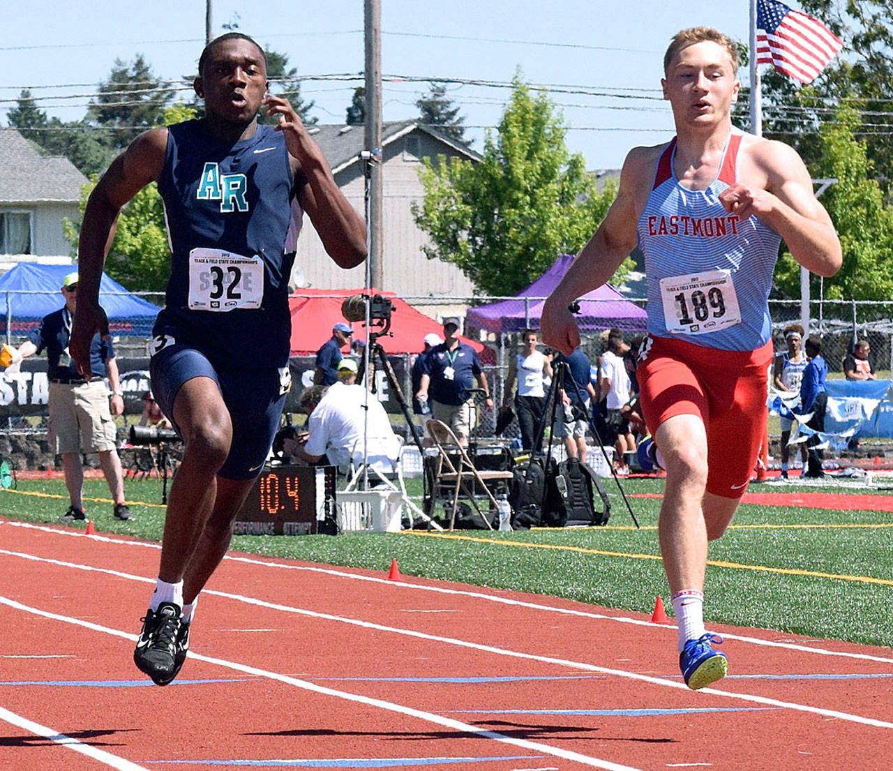Auburn Riverside’s Jaden Robinson, left, scoots to a sixth-place finish in the 4A state 100-meter final in 10.74 seconds. Eastmont’s Jake Ulrich, right, was seventh. Robinson added a seventh-place finish in the 200 final with a time of 21.81. RACHEL CIAMPI, Auburn Reporter