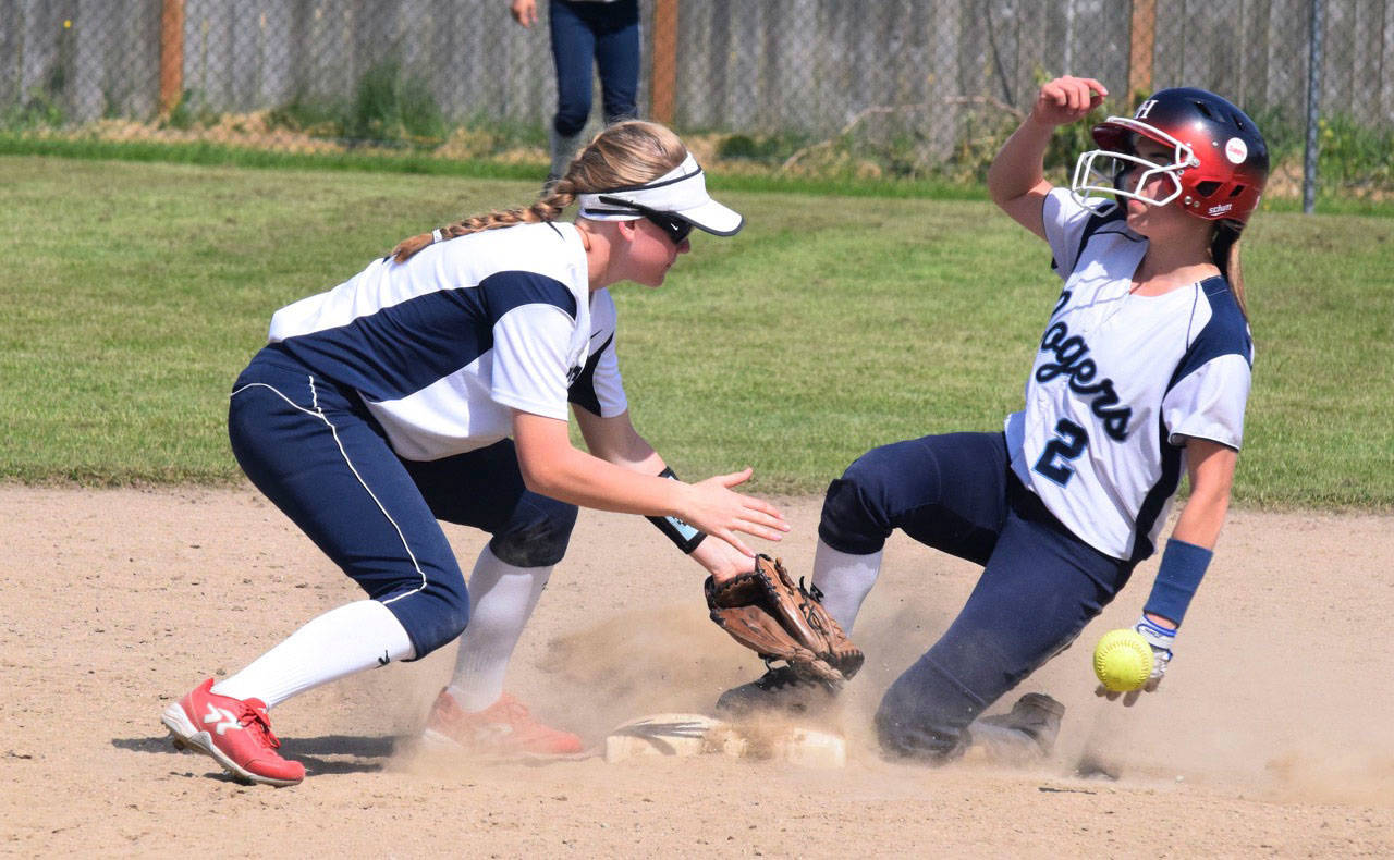 Auburn Riverside’s Madison Muxen tries to put out a Rogers runner at second base during district fastpitch play Sunday at Enumclaw. RACHEL CIAMPI, Auburn Reporter