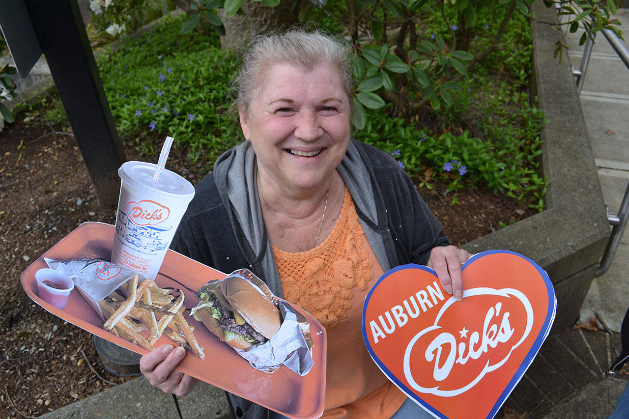 Seriously jonesing for burgers as only a Dick’s Drive-In can cook ‘em up, Elizabeth Gage lent her support to bringing one of the restaurants to Auburn last week at a rally in front of Auburn City Hall. Gage’s daughter, Nanalee, also was at the rally. ROBERT WHALE, Auburn Reporter