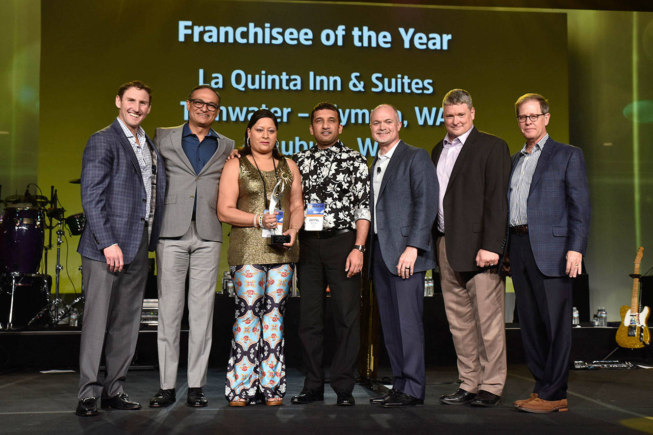 Satpal and Pinder Sohal, owners of the La Quinta Inn & Suites in Auburn and Olympia, recently were honored with the brand’s 2016 Franchisee of the Year award at a conference in Dallas. COURTESY PHOTO