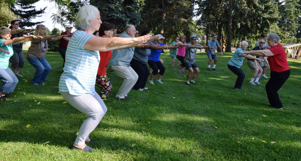 Becky Stirling leads a group in Tai Chi moves. Free Tai Chi classes are available at Les Gove Park every Monday throughout the summer. Check with the Auburn Parks, Arts and Recreation Department for more information. RACHEL CIAMPI, Auburn Reporter