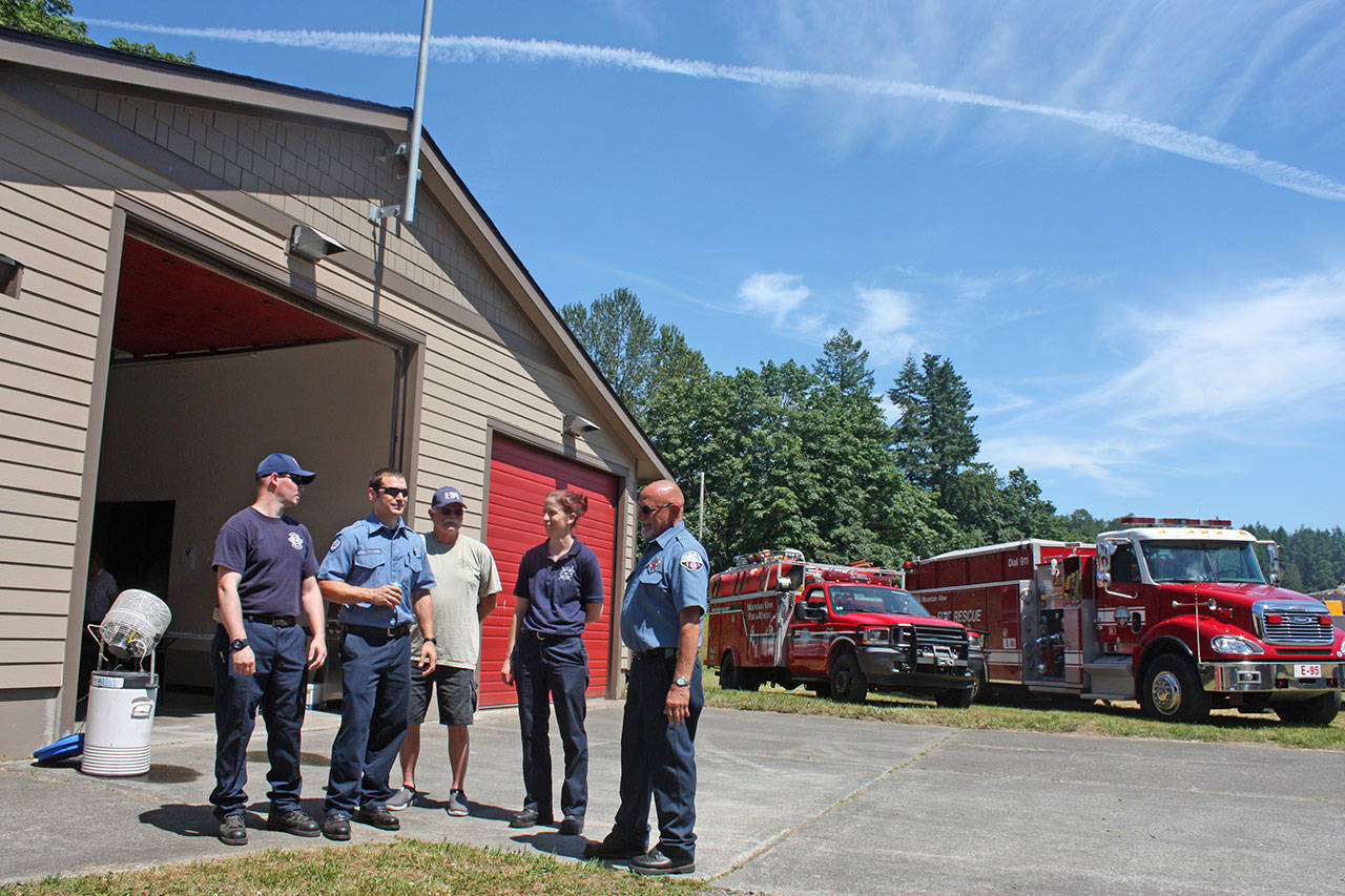 Mountain View Fire & Rescue personnel and volunteers gather in front of remodeled Fire Station 97 during an open house Sunday. MARK KLAAS, Auburn Reporter