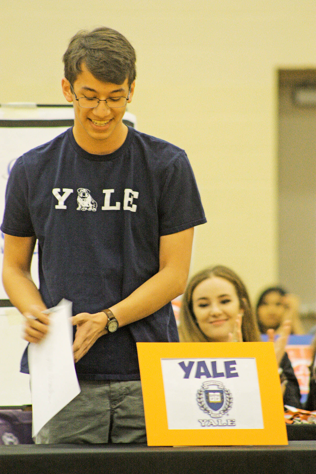 Yale-bound Marty Chandler smiles while receiving a loud ovation from students and faculty during College Signing Day at Auburn Mountainview High School on Monday. MARK KLAAS, Auburn Reporter