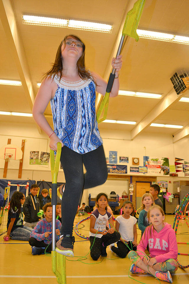 As part of Pioneer Elementary School’s Demonstration Team, 9-year-old Emily Helms shows off her stilt-walking prowess, honed to a fine art under the guidance of P.E. teacher Michael McKinley. ROBERT WHALE, Auburn Reporter