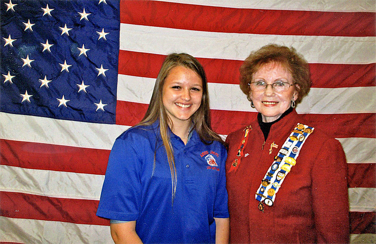 Hilda Meryhew, right, of the Lakota Chapter, DAR National Defense, presents the honor to Cadet Morgan Dixon. COURTESY PHOTO