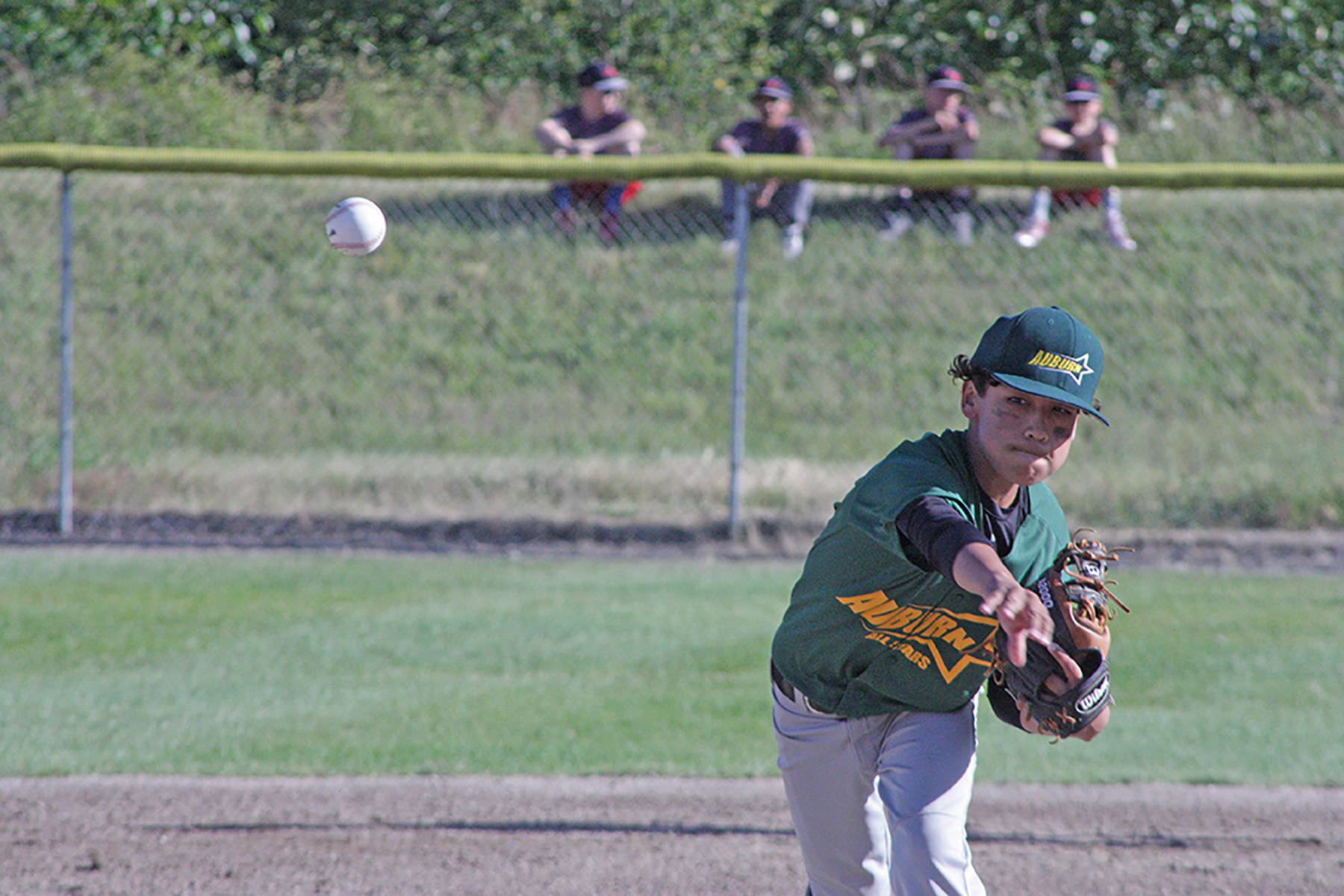 Auburn All-Star Emilio Feliciano unleashes a pitch against Federal Way National in the District 10 championship game Friday. MARK KLAAS, Auburn Reporter