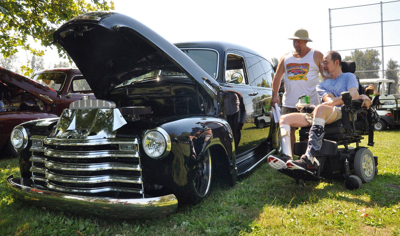 Terry Norman looks at a car with his brother, Tim Norman, during last year’s Show and Shine. Terry Home, the care facility with locations in Auburn and Pacific, is named after Terry Norman, who sustained a traumatic brain injury (TBI) when he was 18. Terry Home began in 1986 with a mother’s dream to find a place for her son. Terry Home provides residents with TBIs the opportunity to work toward a more independent lifestyle through structured programs and activities centered on strengthening daily living skills. REPORTER PHOTO