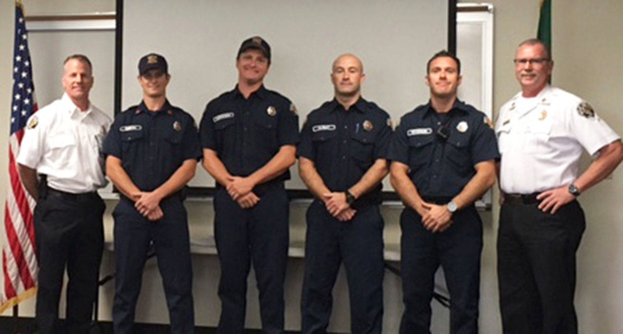 Honored: From left, VRFA Deputy Chief Kevin Olson, Capt. Guy Smith, Firefighters Jordan Gustafson, Stewart Alway and Erik Peterson, and Deputy Chief Brent Swearingen. Not pictured is Firefighter Aaron Walker. COURTESY PHOTO, VRFA