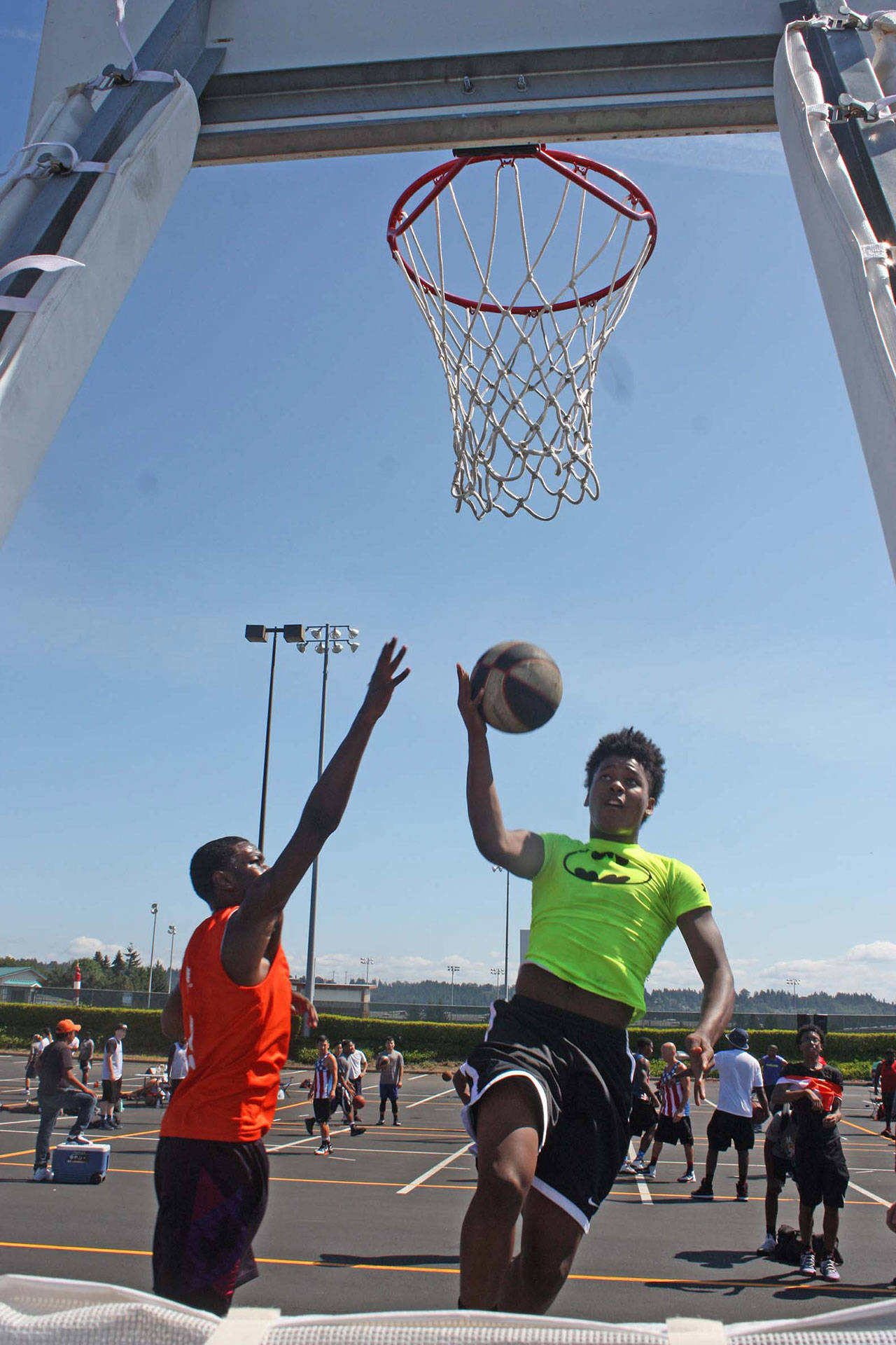 Patreon Lee, a senior-to-be at Auburn High School, drives to the rim during the Marsh Classic 3-on-3 basketball tournament at Emerald Downs last Saturday. MARK KLAAS, Auburn Reporter