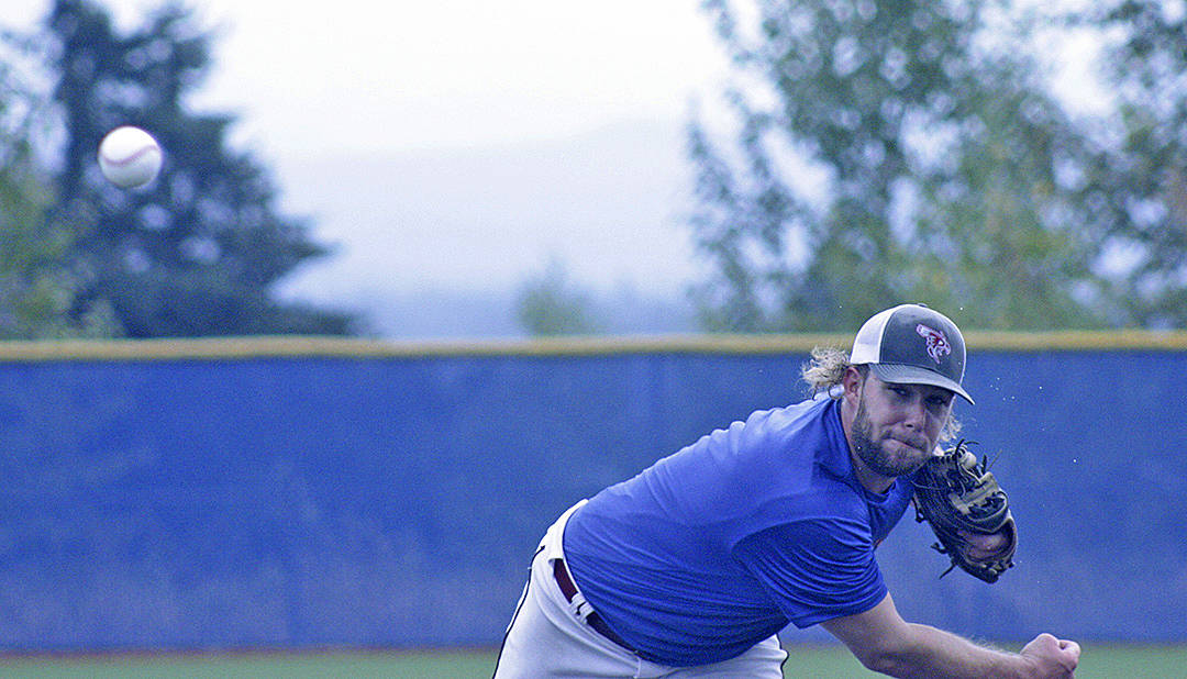 Jacob Phillips, a 2010 Auburn Mountainview graduate, fires a pitch during an alumni baseball game between the Lions and rival Auburn on the Auburn Mountainview High School diamond last Saturday. Phillips, who coaches at Pierce College, joined other top players from Auburn&rsquo;s past glory days for a friendly game. MARK KLAAS, Auburn Reporter