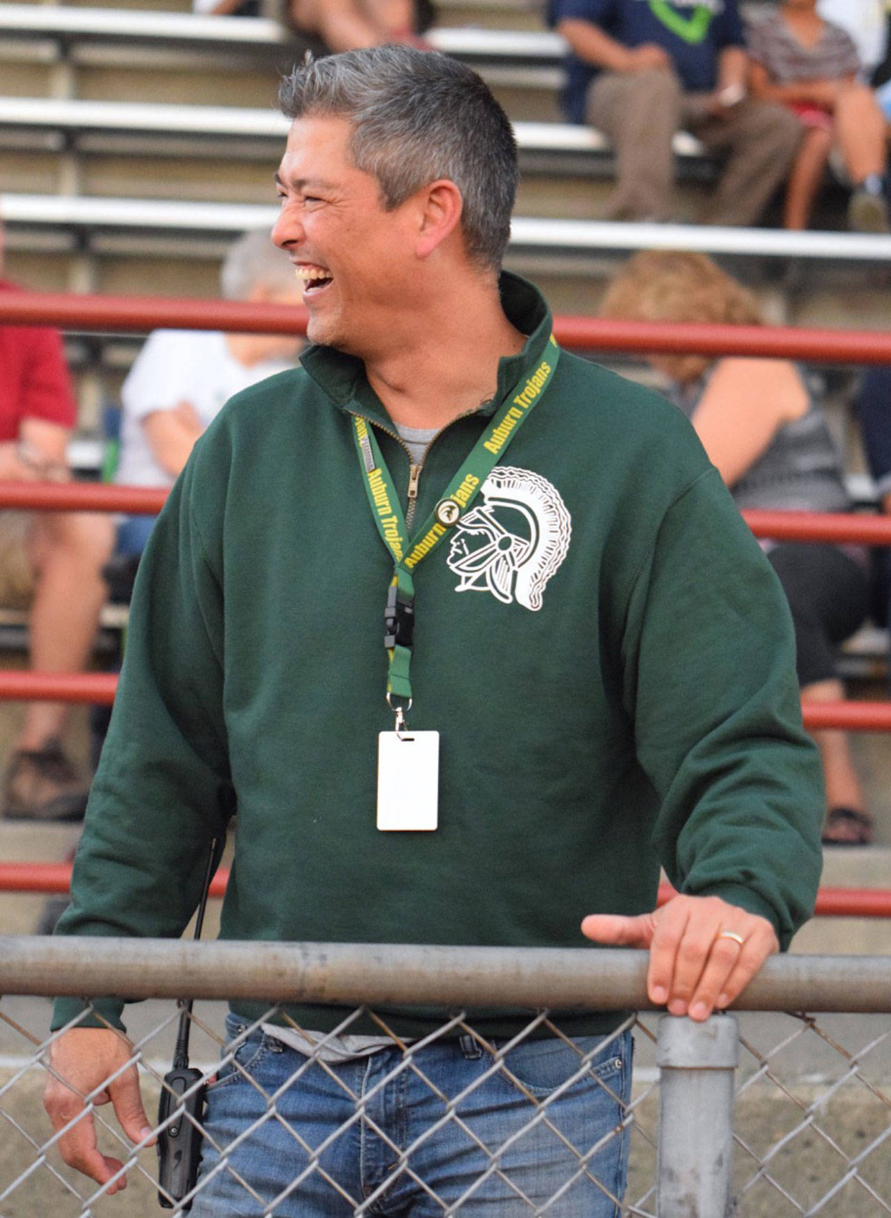 Jeff Gardner, Auburn High’s new principal, shares a laugh with others at a recent Trojans football game. The longtime teacher and coach is settling into his role at the high school. RACHEL CIAMPI, Auburn Reporter