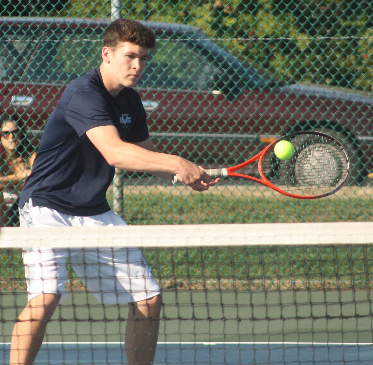 Auburn Riverside’s Tommy Nelson, left, returns a shot during his straight-set victory over Enumclaw’s Brennan Gallagher on Wednesday. KEVIN HANSON, Enumclaw Courier-Herald