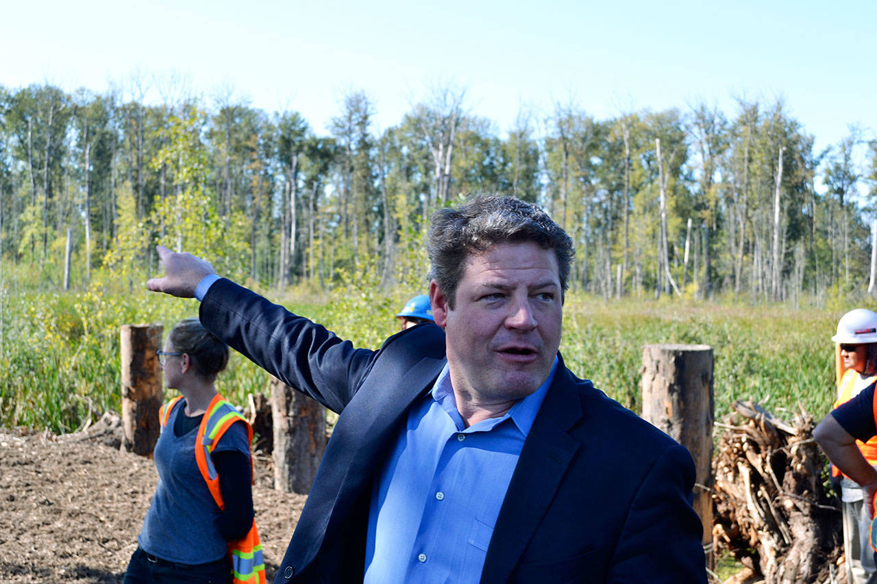 Reagan Dunn, King County Flood Control District chair, points out a feature of the completed Countyline Levee Setback Project and the protection it will provide to the residents who live along the White River. ROBERT WHALE, Auburn Reporter