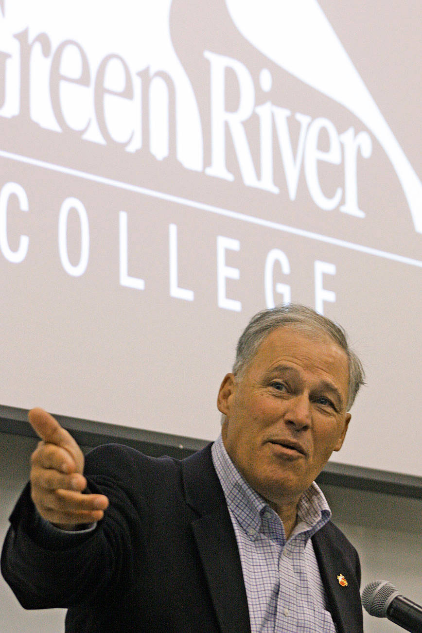 Gov. Jay Inslee talks to a Green River College student during his visit to the Auburn campus last week to discuss climate change. MARK KLAAS, Auburn Reporter