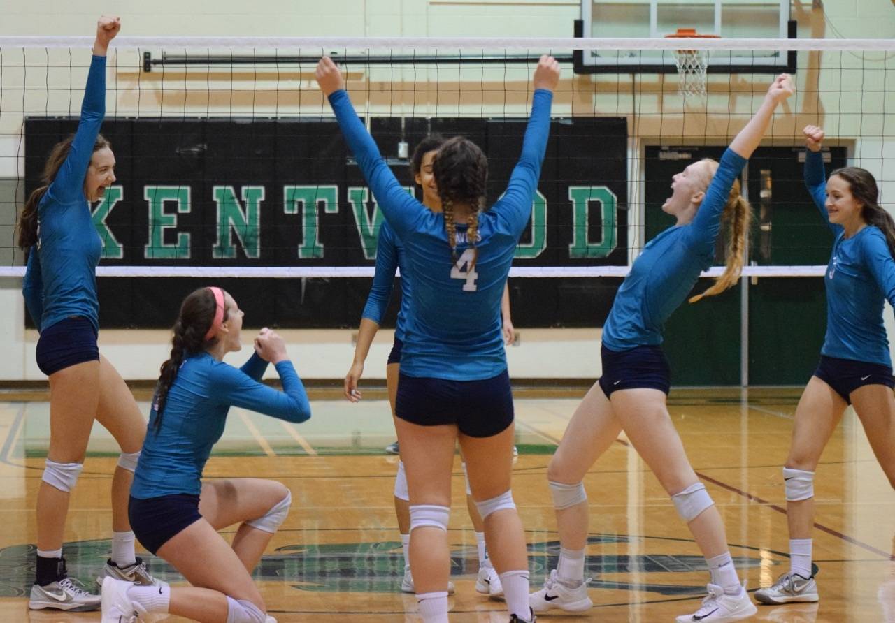 Auburn Riverside players celebrate after defeating Emerald Ridge for the West Central District title at Kentwood High School on Saturday night. The Ravens are returning to the state tournament to defend their championship in Kennewick later this week. RACHEL CIAMPI, Auburn Reporter