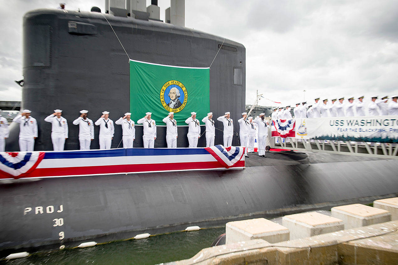 Sailors render a salute during the commissioning ceremony for the Virginia Class Submarine USS Washington (SSN 787) at Naval Station Norfolk. Washington is the U.S. Navys 14th Virginia-class attack submarine and the fourth U.S. Navy ship named for the State of Washington. U.S. Navy photo, Mass Communication Specialist 3rd Class Joshua M. Tolbert