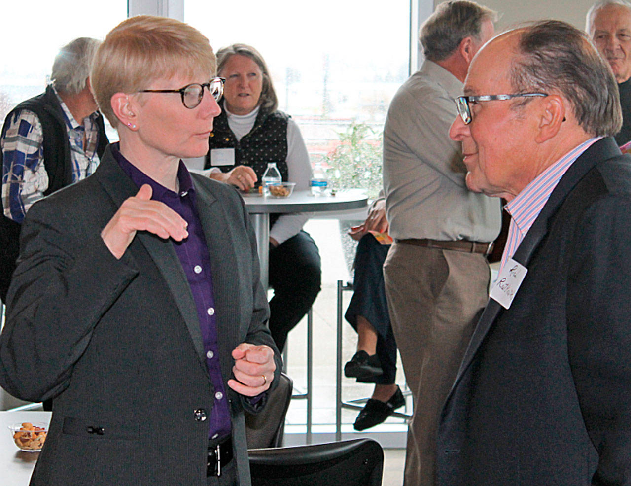Green River College President Suzanne Johnson, left, chats with Rich Rutkowski, past college president, at the recent social. COURTESY PHOTO