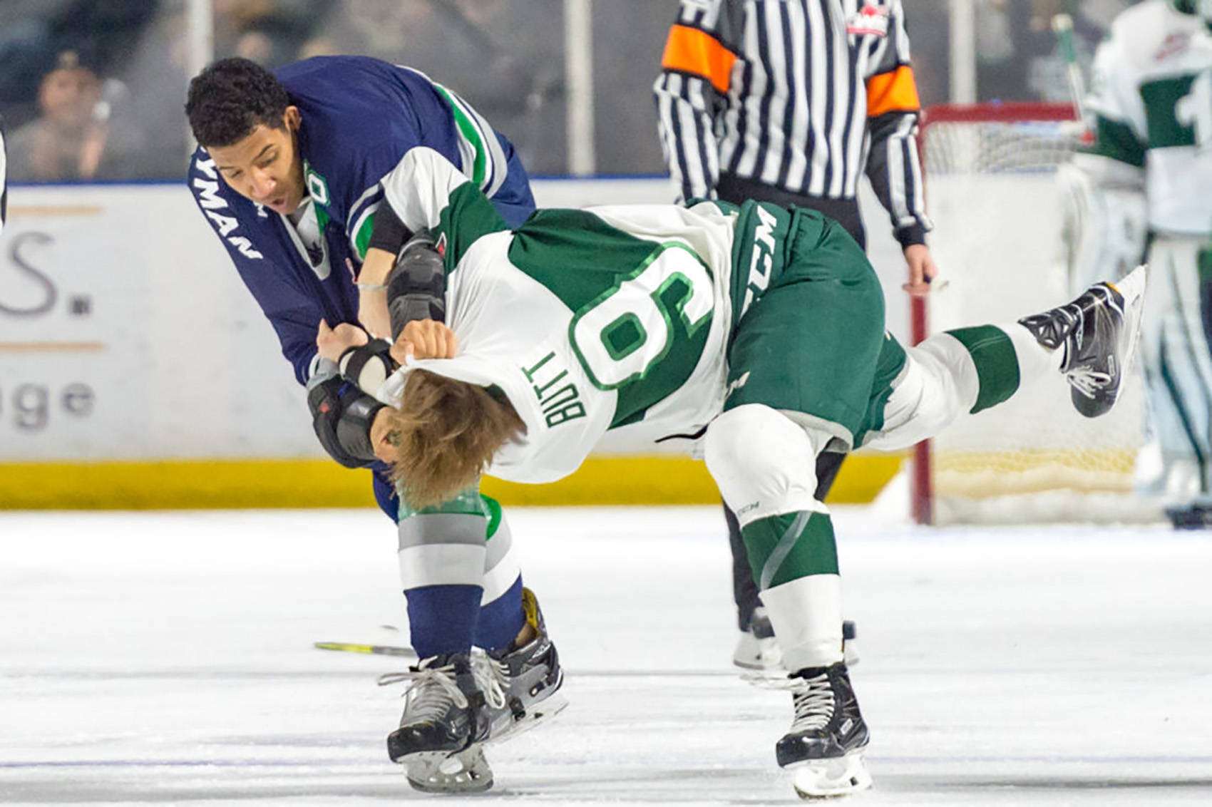 Thunderbirds defenseman Aaron Hyman scuffles with Silvertips right winger Dawson Butt during WHL play at the accesso ShoWare Center on Saturday night. COURTESY PHOTO, Brian Liesse, T-Birds