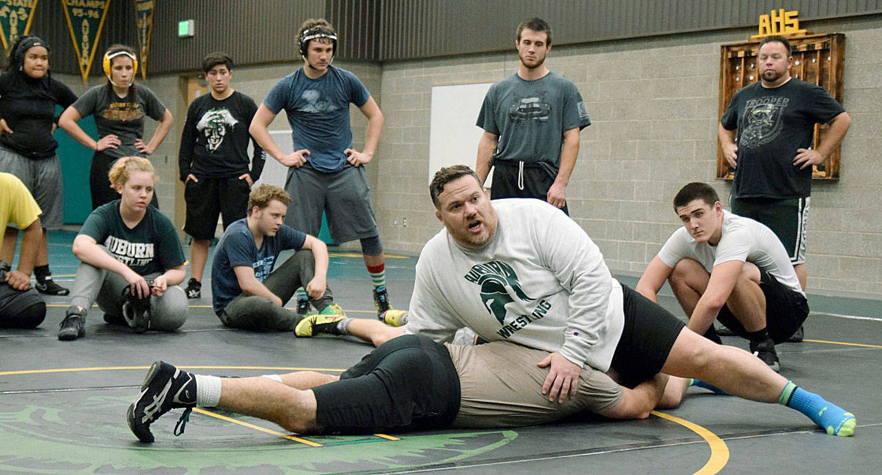 Auburn coach Matt Hoover demonstrates a move with his sparring partner, assistant coach Chad Potts. RACHEL CIAMPI, Auburn Reporter