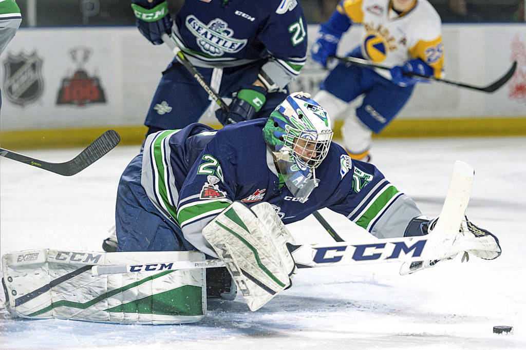 Thunderbirds goalie Matt Berlin reaches to smother the puck during WHL play against Saskatoon on Tuesday night. Berlin made 26 saves in Seattle’s 4-1 win. COURTESY PHOTO, Brian Liesse, Thunderbirds