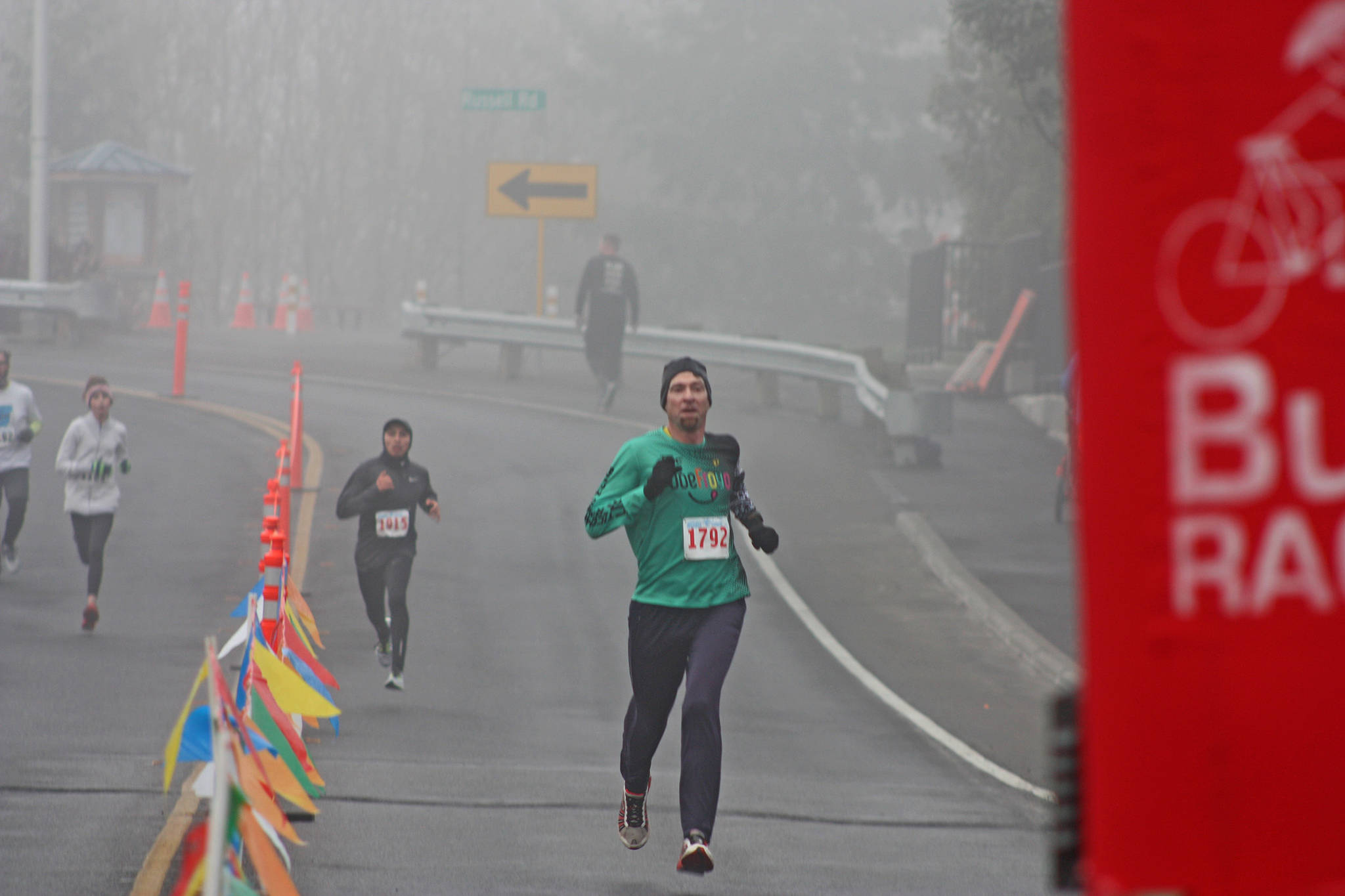 Tacomas Ben Mangrum sprints to the finish line to win Kents 35th annual Christmas Rush Fun Run at Hogan Park at Russell Road on Saturday. Mangrum completed the 10-kilometer (6.2-mile) course in 34 minutes, 13 seconds. MARK KLAAS, Kent Reporter